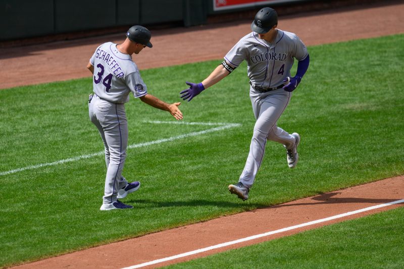 Aug 27, 2023; Baltimore, Maryland, USA; Colorado Rockies first baseman Michael Toglia (4) celebrates with Colorado Rockies third base coach/infield coach Warren Schaeffer (34) after hitting a home run during the fifth inning against the Baltimore Orioles at Oriole Park at Camden Yards. Mandatory Credit: Reggie Hildred-USA TODAY Sports