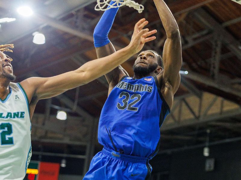 Jan 30, 2025; New Orleans, Louisiana, USA;  Memphis Tigers center Moussa Cisse (32) dunks the ball against the Tulane Green Wave during the first half at Avron B. Fogelman Arena in Devlin Fieldhouse. Mandatory Credit: Stephen Lew-Imagn Images