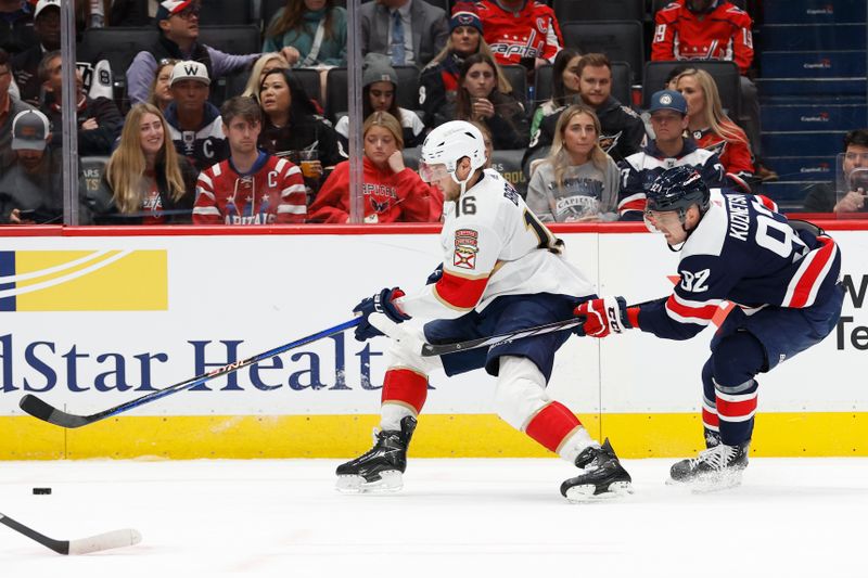 Nov 8, 2023; Washington, District of Columbia, USA; Florida Panthers center Aleksander Barkov (16) skates with the puck as Washington Capitals center Evgeny Kuznetsov (92) chases in the second period at Capital One Arena. Mandatory Credit: Geoff Burke-USA TODAY Sports