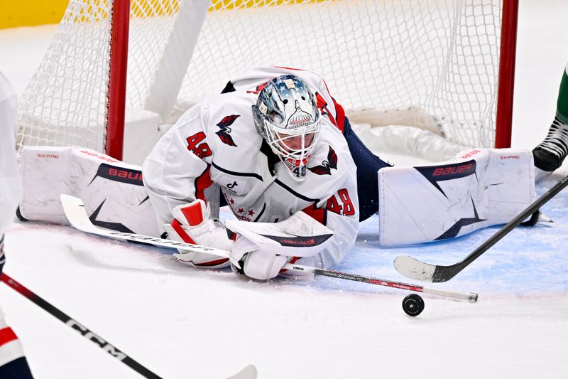 Oct 28, 2025; Dallas, Texas, USA; Washington Capitals goaltender Logan Thompson (48) looks for the puck in the crease during the first period against the Dallas Stars at the American Airlines Center. Mandatory Credit: Jerome Miron-Imagn Images
