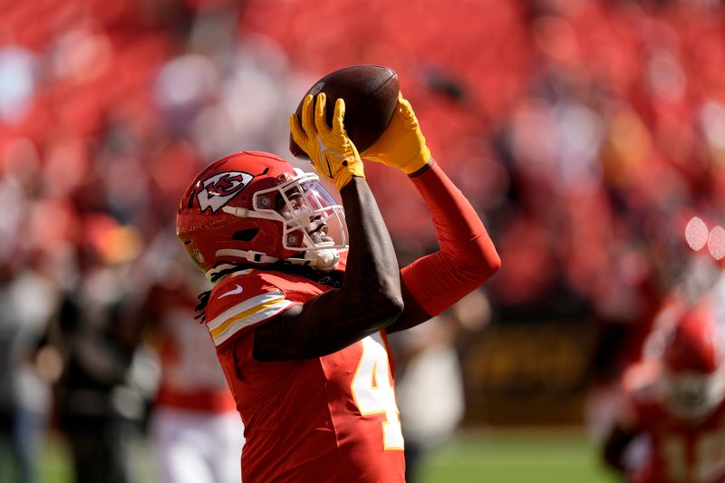 Kansas City Chiefs wide receiver Rashee Rice catches a ball before an NFL football game against the Chicago Bears Sunday, Sept. 24, 2023, in Kansas City, Mo. (AP Photo/Charlie Riedel)