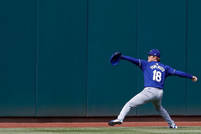 Apr 23, 2024; Washington, District of Columbia, USA; Los Angeles Dodgers pitcher Yoshinobu Yamamoto (18) during a throwing session prior to the Dodgers' game against the Washington Nationals at Nationals Park. Mandatory Credit: Geoff Burke-USA TODAY Sports