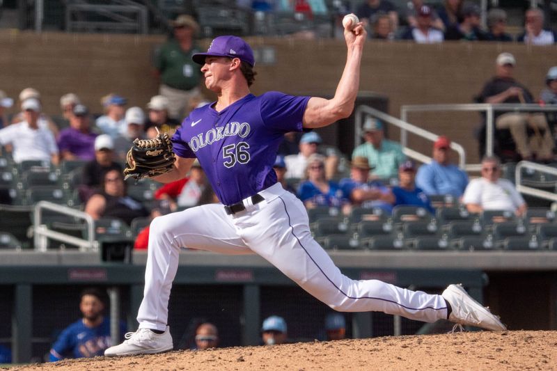 Mar 6, 2024; Salt River Pima-Maricopa, Arizona, USA; Colorado Rockies pitcher Evan Justice (56) on the mound in the eighth during a spring training game against  the Texas Rangers at Salt River Fields at Talking Stick. Mandatory Credit: Allan Henry-USA TODAY Sports