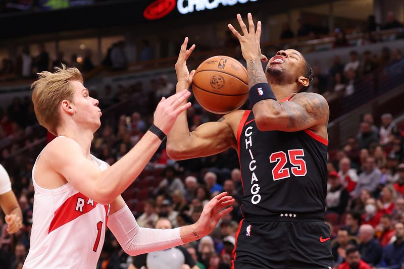 CHICAGO, ILLINOIS - JANUARY 30: Dalen Terry #25 of the Chicago Bulls is fouled by Gradey Dick #1 of the Toronto Raptors during the first half at the United Center on January 30, 2024 in Chicago, Illinois. NOTE TO USER: User expressly acknowledges and agrees that, by downloading and or using this photograph, User is consenting to the terms and conditions of the Getty Images License Agreement.  (Photo by Michael Reaves/Getty Images)