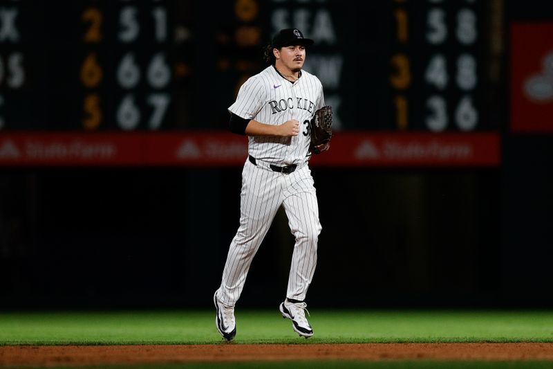 Aug 6, 2024; Denver, Colorado, USA; Colorado Rockies relief pitcher Victor Vodnik (38) comes in to pitch a the start of the ninth inning against the New York Mets at Coors Field. Mandatory Credit: Isaiah J. Downing-USA TODAY Sports