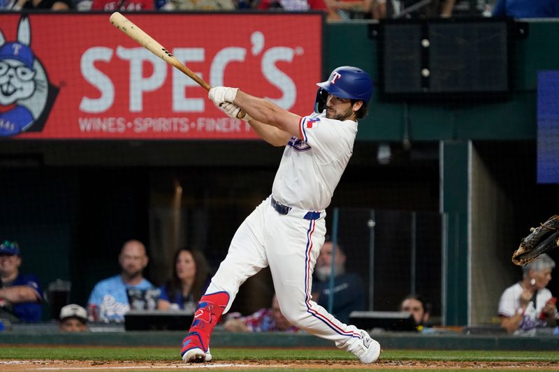 Jul 4, 2024; Arlington, Texas, USA; Texas Rangers third base Josh Smith (8) hits a single during the third inning against the San Diego Padres at Globe Life Field. Mandatory Credit: Raymond Carlin III-USA TODAY Sports