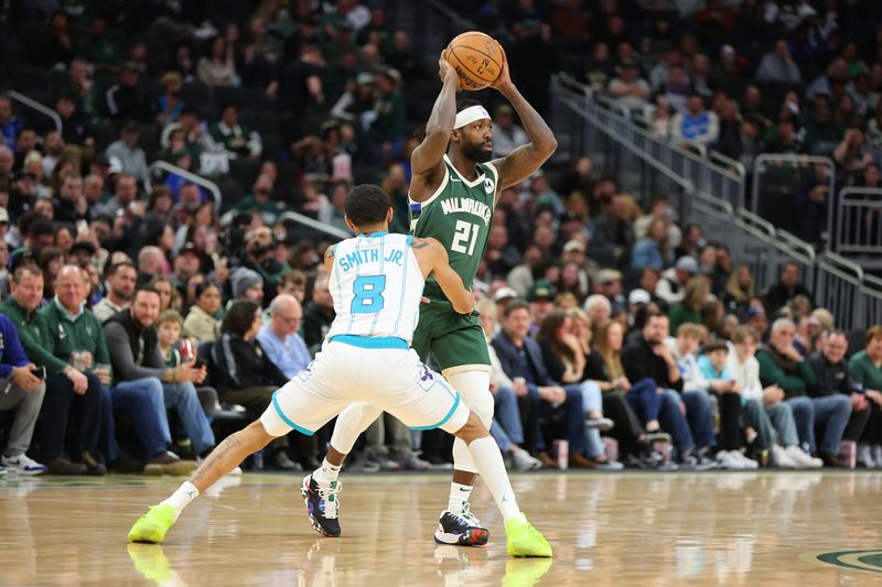 MILWAUKEE, WISCONSIN - FEBRUARY 09: Patrick Beverley #22 of the Milwaukee Bucks is defended by Nick Smith Jr. #8 of the Charlotte Hornets during a game at Fiserv Forum on February 09, 2024 in Milwaukee, Wisconsin. NOTE TO USER: User expressly acknowledges and agrees that, by downloading and or using this photograph, User is consenting to the terms and conditions of the Getty Images License Agreement. (Photo by Stacy Revere/Getty Images)