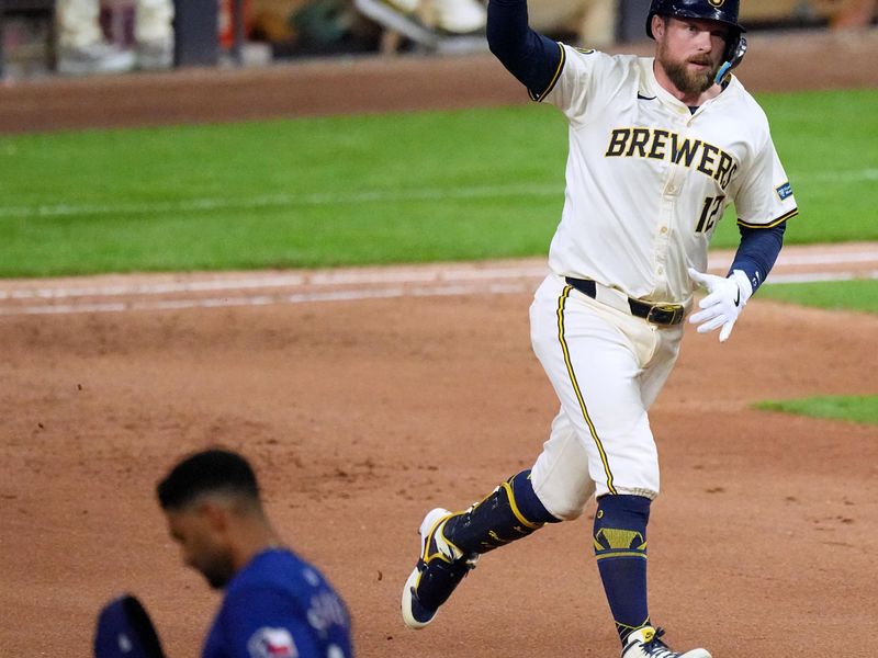 Jun 24, 2024; Milwaukee, Wisconsin, USA; Milwaukee Brewers first base Rhys Hoskins (12) rounds the bases after hitting a grand slam home run during the seventh inning of their game against the Texas Rangers at  American Family Field. Mandatory Credit: Mark Hoffman/INDIANAPOLIS STAR-USA TODAY Sports