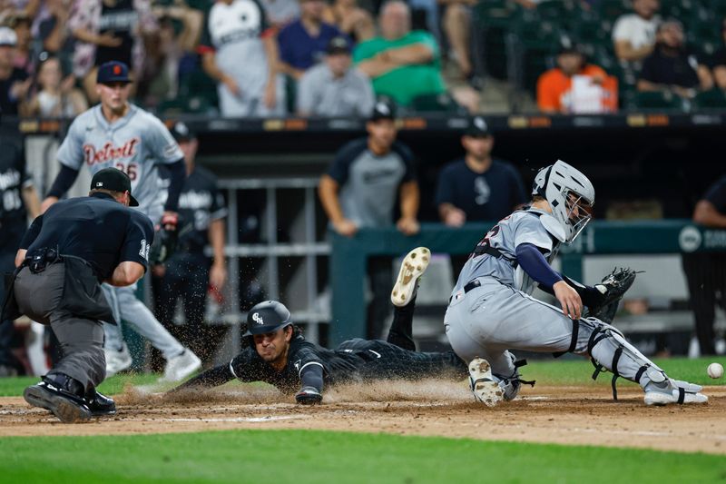 Aug 26, 2024; Chicago, Illinois, USA; Chicago White Sox second baseman Nicky Lopez (8) scores against the Detroit Tigers during the third inning at Guaranteed Rate Field. Mandatory Credit: Kamil Krzaczynski-USA TODAY Sports