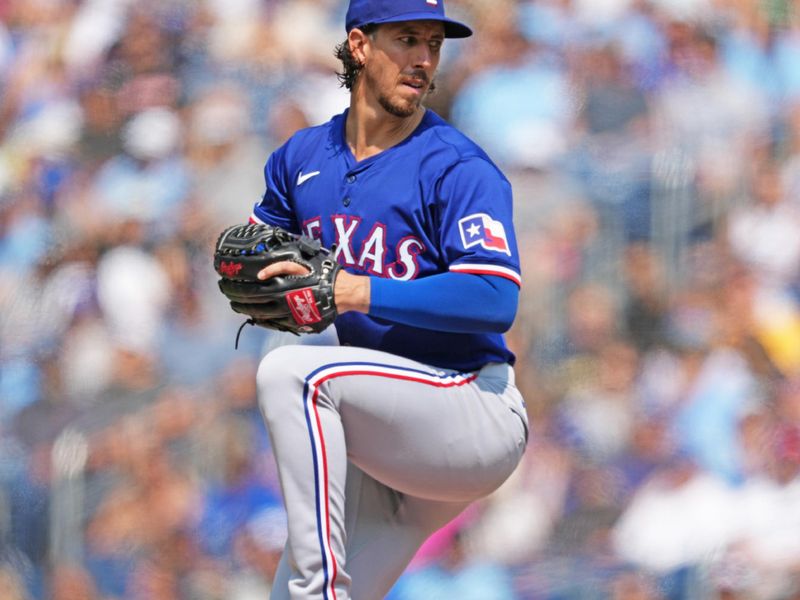 Jul 27, 2024; Toronto, Ontario, CAN; Texas Rangers starting pitcher Michael Lorenzen (23) throws a pitch against the Toronto Blue Jays during the first inning at Rogers Centre. Mandatory Credit: Nick Turchiaro-USA TODAY Sports