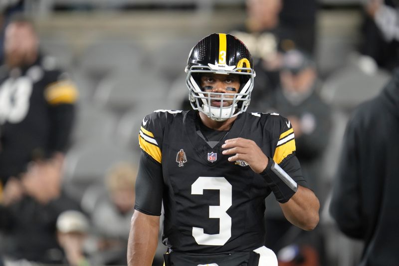 Pittsburgh Steelers quarterback Russell Wilson (3) warms up before an NFL football game against the New York Jets in Pittsburgh, Sunday, Oct. 20, 2024. (AP Photo/Gene J. Puskar)