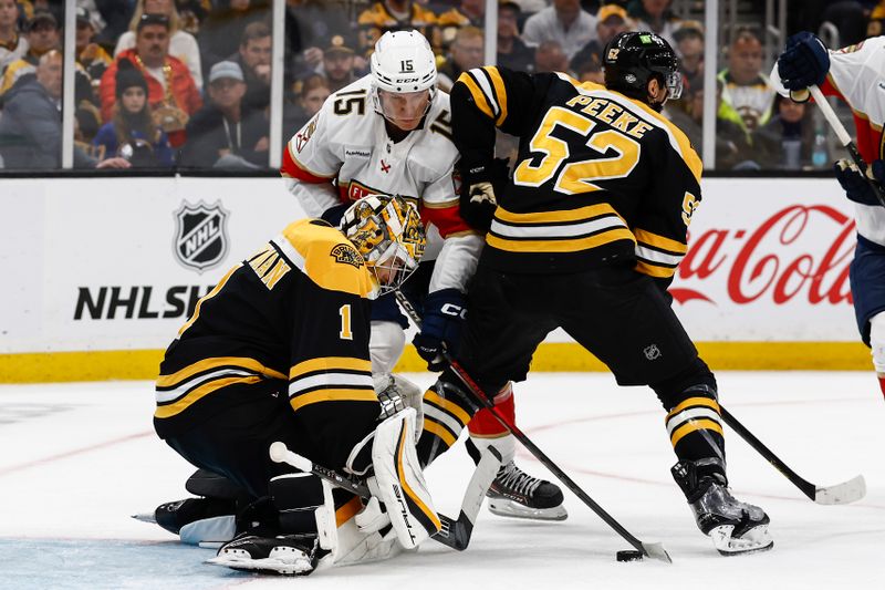 Oct 14, 2024; Boston, Massachusetts, USA; Florida Panthers center Anton Lundell (15) reaches for a loose puck in front of Boston Bruins goaltender Jeremy Swayman (1) during the third period at TD Garden. Mandatory Credit: Winslow Townson-Imagn Images