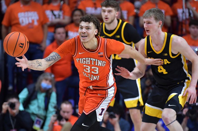 Feb 24, 2024; Champaign, Illinois, USA;  Illinois Fighting Illini forward Coleman Hawkins (33) collects the ball during the second half against the Iowa Hawkeyes at State Farm Center. Mandatory Credit: Ron Johnson-USA TODAY Sports