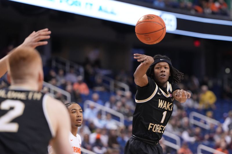 Mar 8, 2023; Greensboro, NC, USA; Wake Forest Demon Deacons guard Tyree Appleby (1) passes the ball to guard Cameron Hildreth (2) in the first half of the second round at Greensboro Coliseum. Mandatory Credit: Bob Donnan-USA TODAY Sports