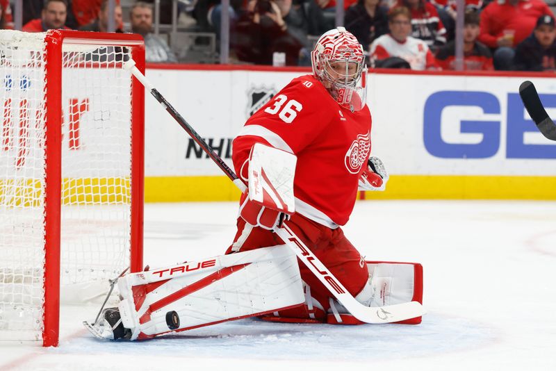 Jan 12, 2026; Detroit, Michigan, USA;  Detroit Red Wings goaltender John Gibson (36) makes the save in the first period against the Carolina Hurricanes at Little Caesars Arena. Mandatory Credit: Rick Osentoski-Imagn Images