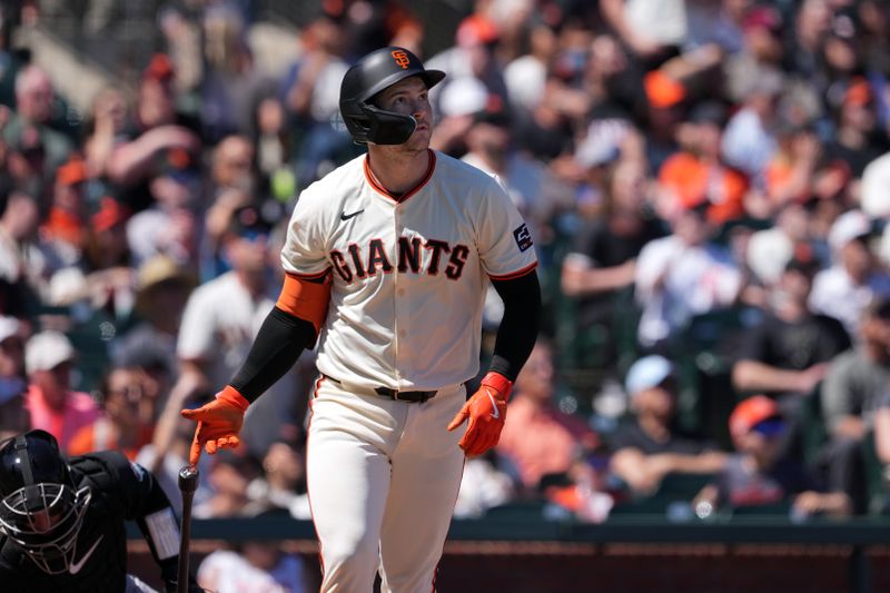 Apr 20, 2024; San Francisco, California, USA; San Francisco Giants catcher Patrick Bailey (14) hits a home run against the Arizona Diamondbacks during the fifth inning at Oracle Park. Mandatory Credit: Darren Yamashita-USA TODAY Sports