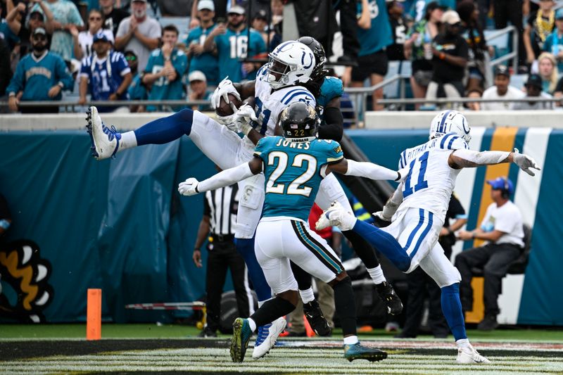 Indianapolis Colts' Mo Alie-Cox (81) makes a touchdown catch during the second half of an NFL football game against the Jacksonville Jaguars, Sunday, Oct. 6, 2024, in Jacksonville, Fla. (AP Photo/Phelan M. Ebenhack)