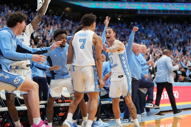 Feb 7, 2026; Chapel Hill, North Carolina, USA; North Carolina Tar Heels guard Seth Trimble (7) and bench react after hitting the game winning shot in the second  half at Dean E. Smith Center. Mandatory Credit: Bob Donnan-Imagn Images