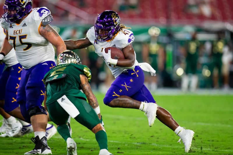 Oct 10, 2020; Tampa, Florida, USA;  East Carolina Pirates running back Rahjai Harris (47) rushes during the first quarter of a game against the South Florida Bulls at Raymond James Stadium. Mandatory Credit: Mary Holt-USA TODAY Sports