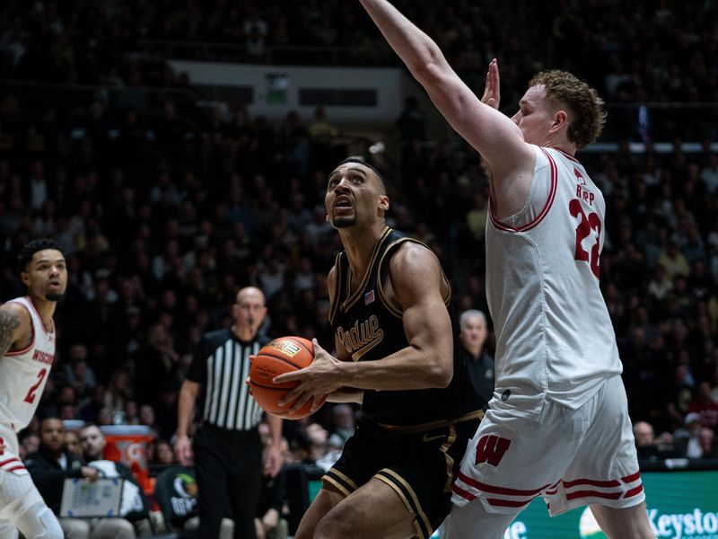 Mar 7, 2026; West Lafayette, Indiana, USA; Purdue Boilermakers forward Trey Kaufman-Renn (4) looks to shoot the ball as Wisconsin Badgers forward Austin Rapp (22) guards during the second half at Mackey Arena. Mandatory Credit: Jacob Musselman-Imagn Images Mar 7, 2026; West Lafayette, Indiana, USA; Purdue Boilermakers forward Trey Kaufman-Renn (4) looks to shoot the ball as Wisconsin Badgers forward Austin Rapp (22) guards during the second half at Mackey Arena. Mandatory Credit: Jacob Musselman-Imagn Images