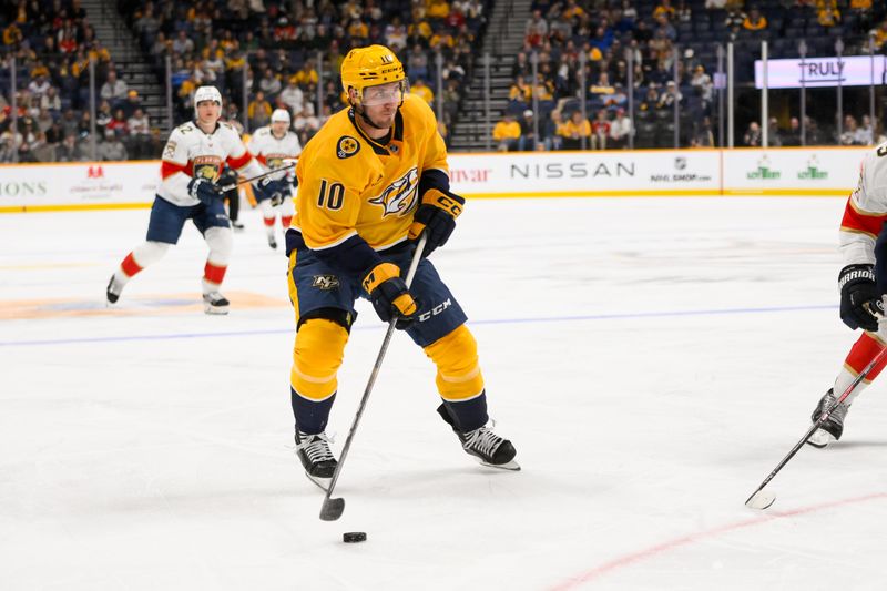 Feb 25, 2025; Nashville, Tennessee, USA;  Nashville Predators center Colton Sissons (10) skates with the puck against the Florida Panthers during the third half at Bridgestone Arena. Mandatory Credit: Steve Roberts-Imagn Images