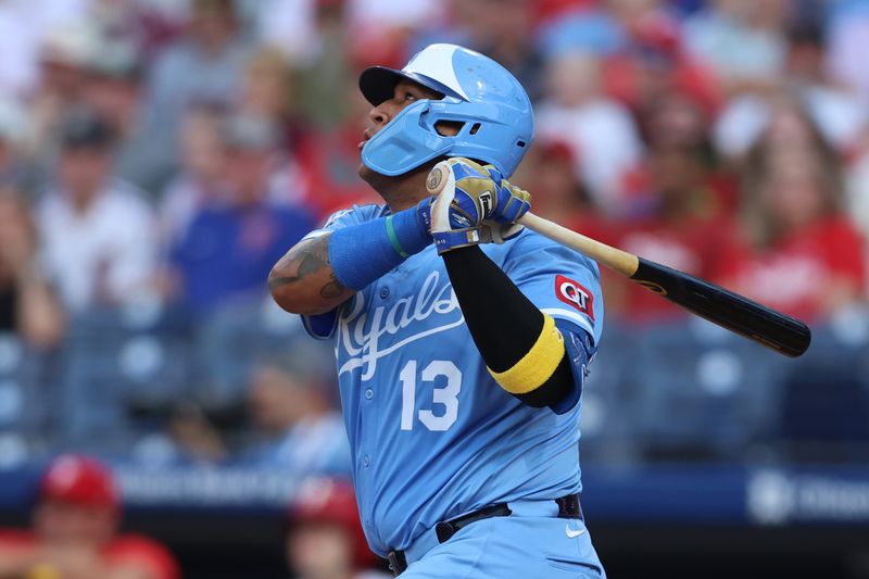 Sep 13, 2025; Philadelphia, Pennsylvania, USA; Kansas City Royals catcher Salvador Perez (13) hits a two RBI home run against the Philadelphia Phillies during the first inning at Citizens Bank Park. Mandatory Credit: Bill Streicher-Imagn Images