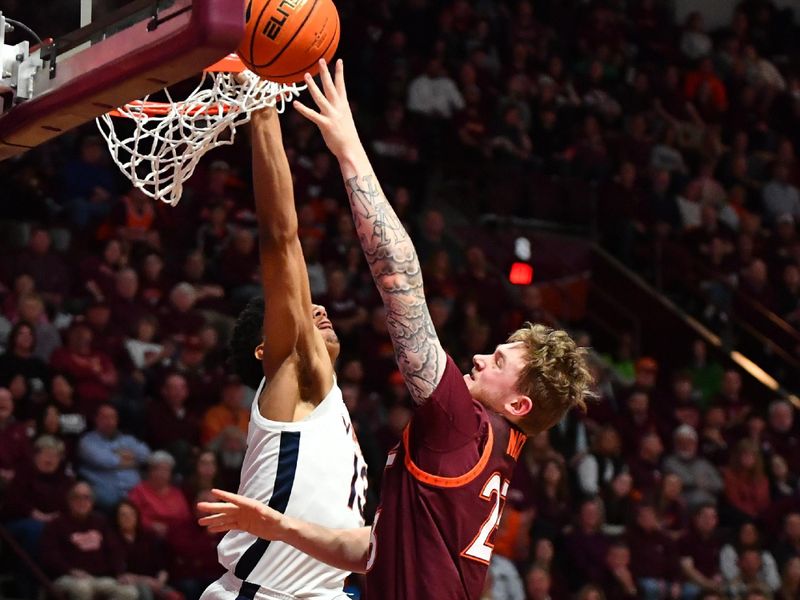 Feb 19, 2024; Blacksburg, Virginia, USA; Virginia Tech Hokies guard Tyler Nickel (23) shoots against Virginia Cavaliers guard Ryan Dunn (13) defends during the second half at Cassell Coliseum. Mandatory Credit: Brian Bishop-USA TODAY Sports