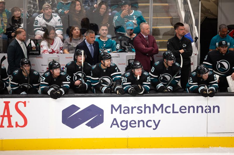 Oct 12, 2024; San Jose, California, USA; The San Jose Sharks bench watches their teammates take on the Anaheim Ducks during the third period at SAP Center at San Jose. Mandatory Credit: D. Ross Cameron-Imagn Images