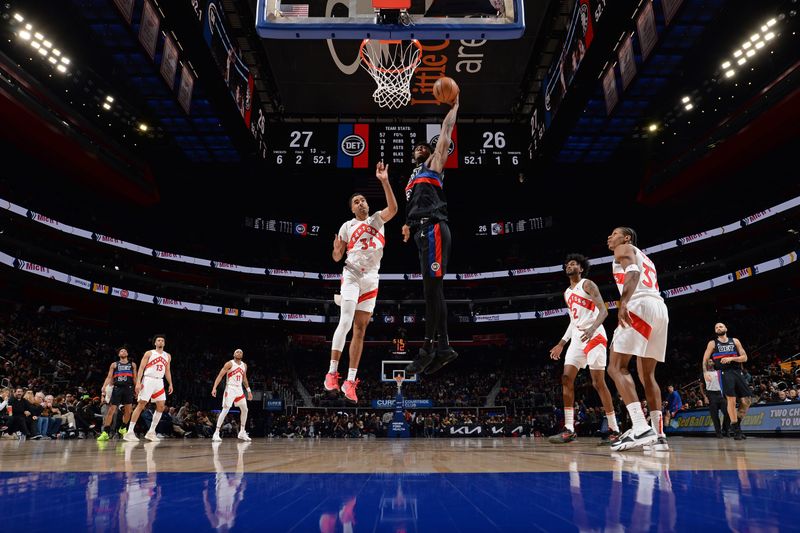 DETROIT, MI - MARCH 13: James Wiseman #13 of the Detroit Pistons drives to the basket during the game against the Toronto Raptors on March 13, 2024 at Little Caesars Arena in Detroit, Michigan. NOTE TO USER: User expressly acknowledges and agrees that, by downloading and/or using this photograph, User is consenting to the terms and conditions of the Getty Images License Agreement. Mandatory Copyright Notice: Copyright 2024 NBAE (Photo by Chris Schwegler/NBAE via Getty Images)