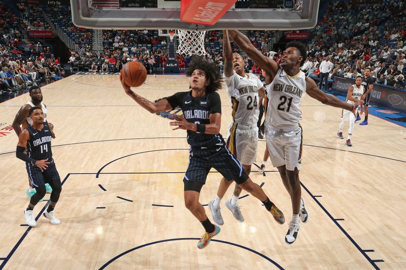 NEW ORLEANS, LA - OCTOBER 7: Anthony Black #0 of the Orlando Magic drives to the basket during the game against the New Orleans Pelicans on October 7, 2024 at the Smoothie King Center in New Orleans, Louisiana. NOTE TO USER: User expressly acknowledges and agrees that, by downloading and or using this Photograph, user is consenting to the terms and conditions of the Getty Images License Agreement. Mandatory Copyright Notice: Copyright 2024 NBAE (Photo by Layne Murdoch Jr./NBAE via Getty Images)