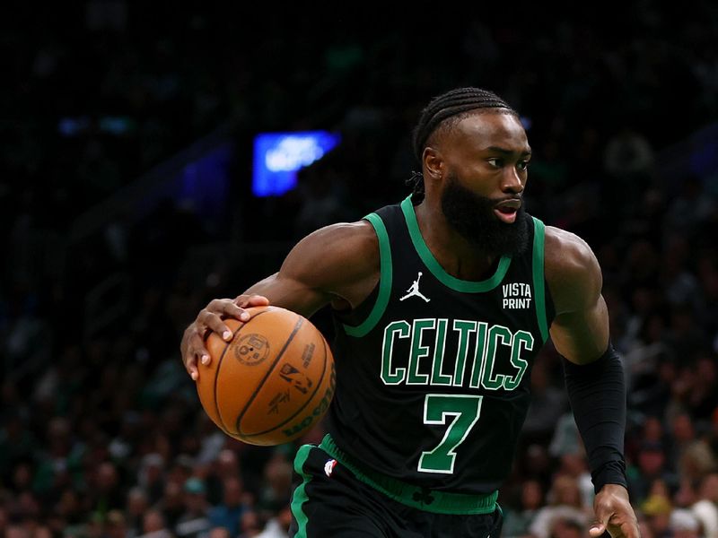 BOSTON, MASSACHUSETTS - DECEMBER 01: Jaylen Brown #7 of the Boston Celtics dribbles against the Philadelphia 76ers during the second quarter at TD Garden on December 01, 2023 in Boston, Massachusetts. NOTE TO USER: User expressly acknowledges and agrees that, by downloading and or using this photograph, User is consenting to the terms and conditions of the Getty Images License Agreement.  (Photo by Maddie Meyer/Getty Images)