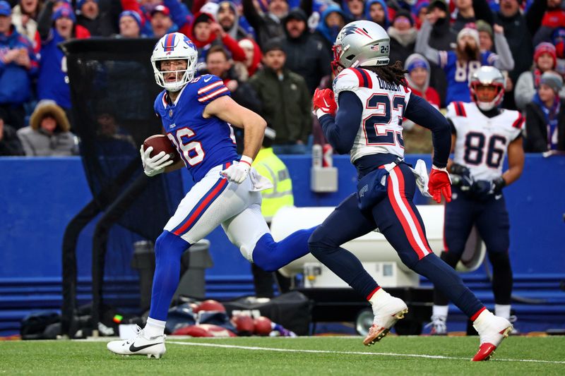 Buffalo Bills tight end Dalton Kincaid (86) runs after a catch with New England Patriots safety Kyle Dugger (23) defending during the second half of an NFL football game in Orchard Park, N.Y., Sunday, Dec. 31, 2023. (AP Photo/Jeffrey T. Barnes)