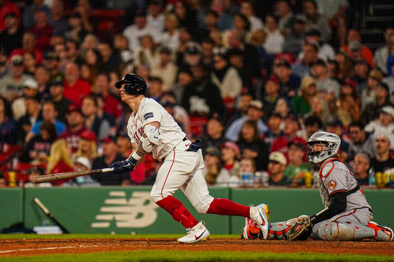 Sep 9, 2024; Boston, Massachusetts, USA; Boston Red Sox designated hitter Tyler O'Neill (17) hits a home run against the Baltimore Orioles in the eighth inning at Fenway Park. Mandatory Credit: David Butler II-Imagn Images