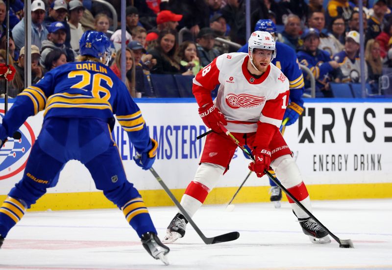 Oct 22, 2025; Buffalo, New York, USA;  Detroit Red Wings center Andrew Copp (18) looks to make a pass as Buffalo Sabres defenseman Rasmus Dahlin (26) defends during the first period at KeyBank Center. Mandatory Credit: Timothy T. Ludwig-Imagn Images
