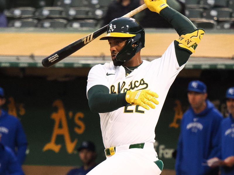 Jun 19, 2024; Oakland, California, USA; Oakland Athletics left fielder Miguel Andujar (22) on a swing against the Kansas City Royals during the fifth inning at Oakland-Alameda County Coliseum. Mandatory Credit: Kelley L Cox-USA TODAY Sports