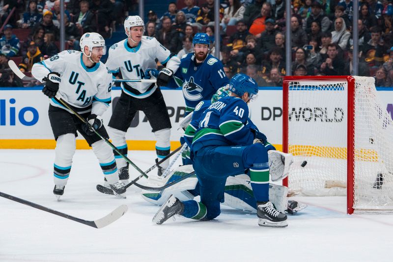 Mar 16, 2025; Vancouver, British Columbia, CAN; Utah Hockey Club defenseman Ian Cole (28) and forward Nick Bjugstad (17) and Vancouver Canucks defenseman Filip Hronek (17) and forward Elias Pettersson (40) and goalie Kevin Lankinen (32) watch as forward Kevin Stenlund (82) scores in the second period at Rogers Arena. Mandatory Credit: Bob Frid-Imagn Images