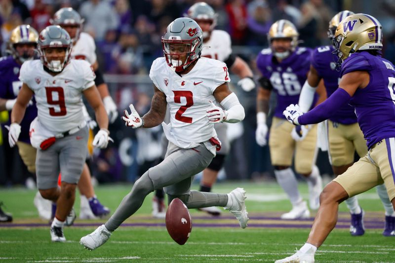 Nov 25, 2023; Seattle, Washington, USA; Washington State Cougars wide receiver Kyle Williams (2) drops a pass against the Washington Huskies during the fourth quarter at Alaska Airlines Field at Husky Stadium. Mandatory Credit: Joe Nicholson-USA TODAY Sports