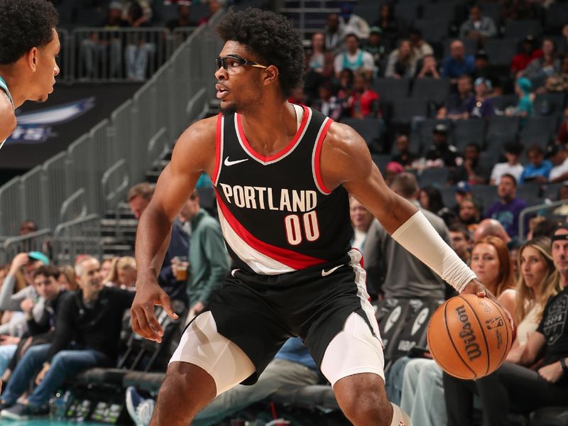 CHARLOTTE, NC - APRIL 3: Scoot Henderson #00 of the Portland Trail Blazers handles the ball during the game  on April 3, 2024 at Spectrum Center in Charlotte, North Carolina. NOTE TO USER: User expressly acknowledges and agrees that, by downloading and or using this photograph, User is consenting to the terms and conditions of the Getty Images License Agreement. Mandatory Copyright Notice: Copyright 2024 NBAE (Photo by Kent Smith/NBAE via Getty Images)