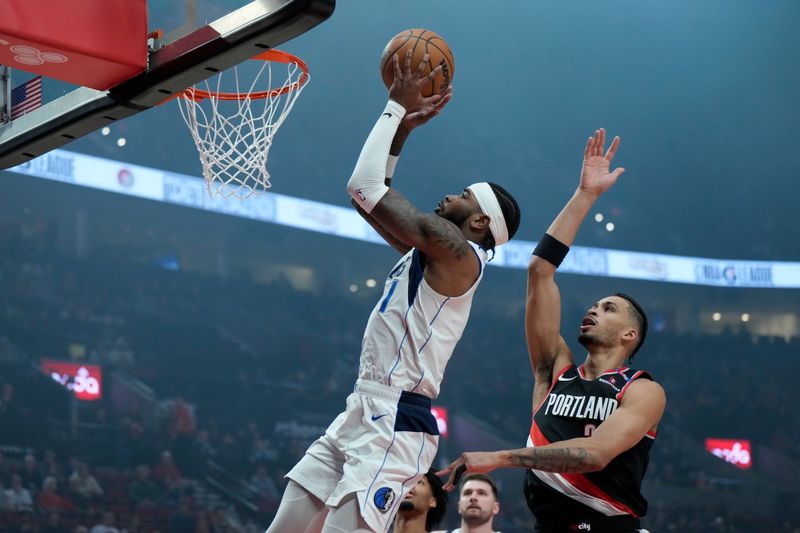 PORTLAND, OREGON - DECEMBER 01: Jaden Hardy #1 of the Dallas Mavericks drives to the basket past Toumani Camara #33 of the Portland Trail Blazers during the first half at Moda Center on December 01, 2024 in Portland, Oregon. NOTE TO USER: User expressly acknowledges and agrees that, by downloading and or using this photograph, User is consenting to the terms and conditions of the Getty Images License Agreement. (Photo by Soobum Im/Getty Images)