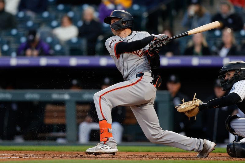 May 7, 2024; Denver, Colorado, USA; San Francisco Giants shortstop Nick Ahmed (16) hits an RBI single in the fourth inning against the Colorado Rockies at Coors Field. Mandatory Credit: Isaiah J. Downing-USA TODAY Sports