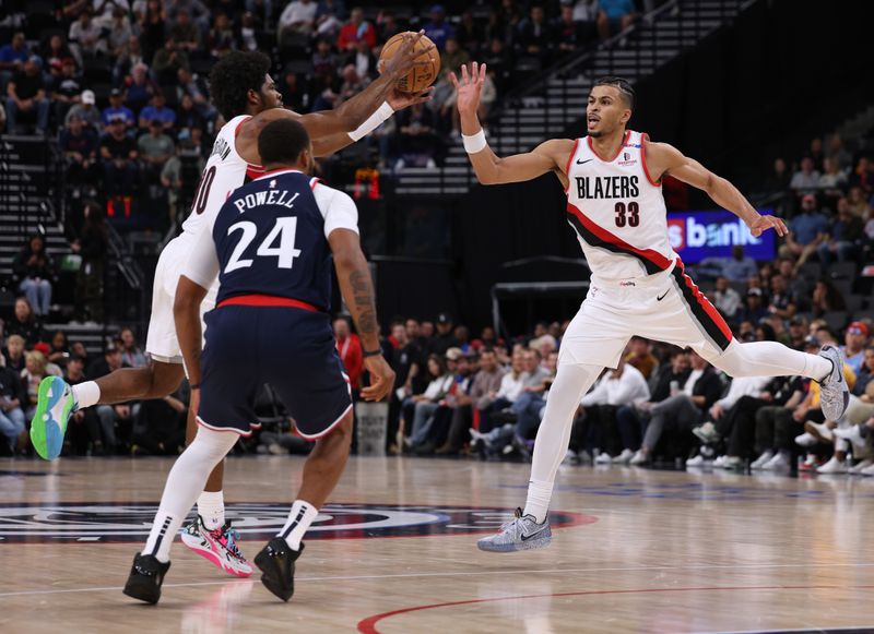 INGLEWOOD, CALIFORNIA - OCTOBER 30: Toumani Camara #33 and Scoot Henderson #00 of the Portland Trail Blazers catch a pass in front of Norman Powell #24 of the LA Clippers during a 106-105 Trail Blazers win at Intuit Dome on October 30, 2024 in Inglewood, California. (Photo by Harry How/Getty Images). NOTE TO USER: User expressly acknowledges and agrees that, by downloading and or using this photograph, User is consenting to the terms and conditions of the Getty Images License Agreement. (Photo by Harry How/Getty Images)