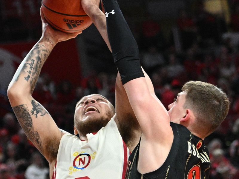 Feb 11, 2023; Lincoln, Nebraska, USA;  Nebraska Cornhuskers guard C.J. Wilcher (0) attempts a shot against Wisconsin Badgers guard Connor Essegian (3) in the first half at Pinnacle Bank Arena. Mandatory Credit: Steven Branscombe-USA TODAY Sports