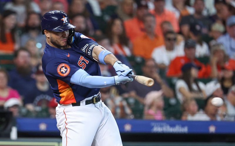 Jun 18, 2023; Houston, Texas, USA; Houston Astros designated hitter Yainer Diaz (21) hits a single during the first inning against the Cincinnati Reds at Minute Maid Park. Mandatory Credit: Troy Taormina-USA TODAY Sports