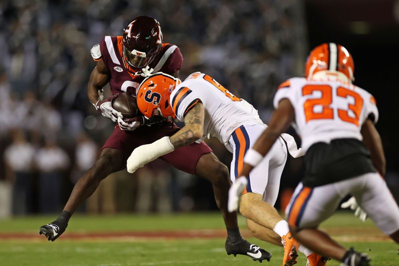 Oct 26, 2023; Blacksburg, Virginia, USA; Virginia Tech Hokies wide receiver Da'Wain Lofton (3) is hit by Syracuse Orange defensive back Justin Barron (8) during the first quarter at Lane Stadium. Mandatory Credit: Peter Casey-USA TODAY Sports