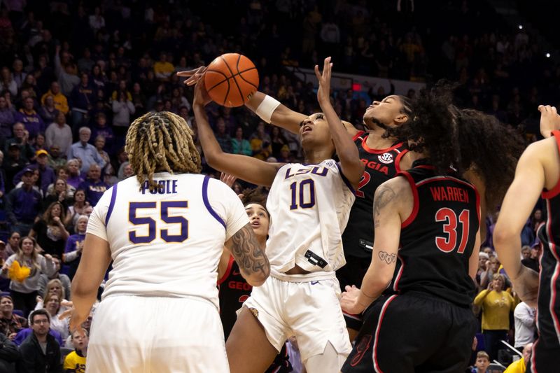 Feb 2, 2023; Baton Rouge, Louisiana, USA;  LSU Lady Tigers forward Angel Reese (10) grabs a rebound against Georgia Lady Bulldogs guard Savannah Henderson (2) during overtime at Pete Maravich Assembly Center. Mandatory Credit: Stephen Lew-USA TODAY Sports