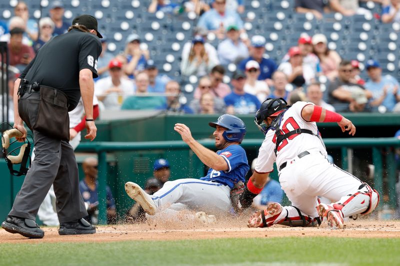 Sep 26, 2024; Washington, District of Columbia, USA; Kansas City Royals shortstop Paul DeJong (15) scores a run ahead of a tag by Washington Nationals catcher Keibert Ruiz (20) during the fourth inning at Nationals Park. Mandatory Credit: Geoff Burke-Imagn Images