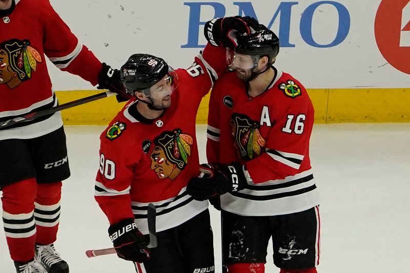 Feb 17, 2024; Chicago, Illinois, USA; Chicago Blackhawks center Jason Dickinson (16) celebrates his game winning goal against the Ottawa Senators  with center Tyler Johnson (90) during the third period at United Center. Mandatory Credit: David Banks-USA TODAY Sports