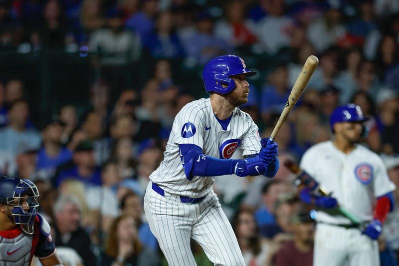 Sep 19, 2024; Chicago, Illinois, USA; Chicago Cubs shortstop Dansby Swanson (7) singles against the Washington Nationals during the seventh inning at Wrigley Field. Mandatory Credit: Kamil Krzaczynski-Imagn Images