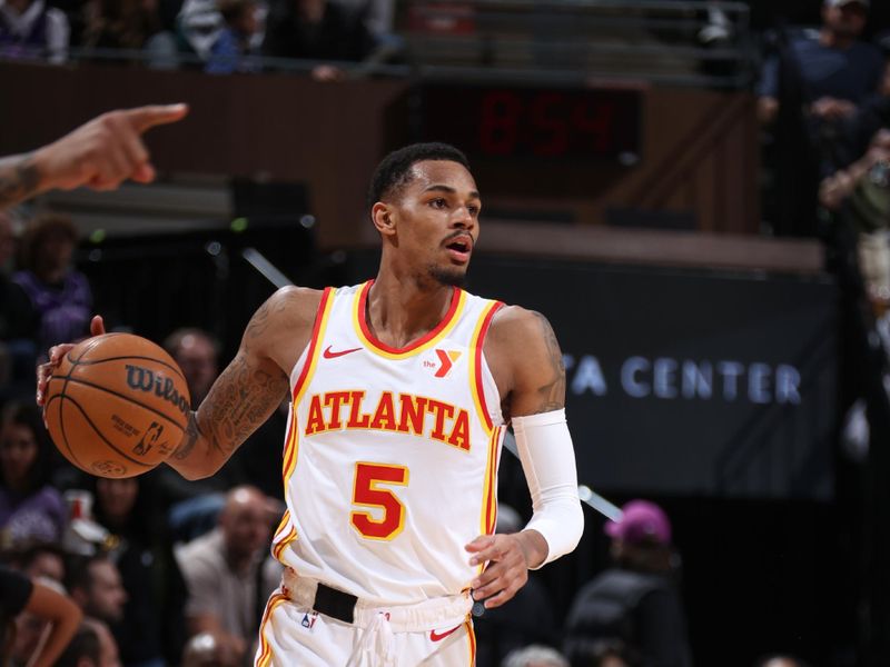 SALT LAKE CITY, UT - MARCH 15:  Dejounte Murray #5 of the Atlanta Hawks handles the ball during the game  on March 15, 2024 at Delta Center in Salt Lake City, Utah. NOTE TO USER: User expressly acknowledges and agrees that, by downloading and or using this Photograph, User is consenting to the terms and conditions of the Getty Images License Agreement. Mandatory Copyright Notice: Copyright 2024 NBAE (Photo by Melissa Majchrzak/NBAE via Getty Images)