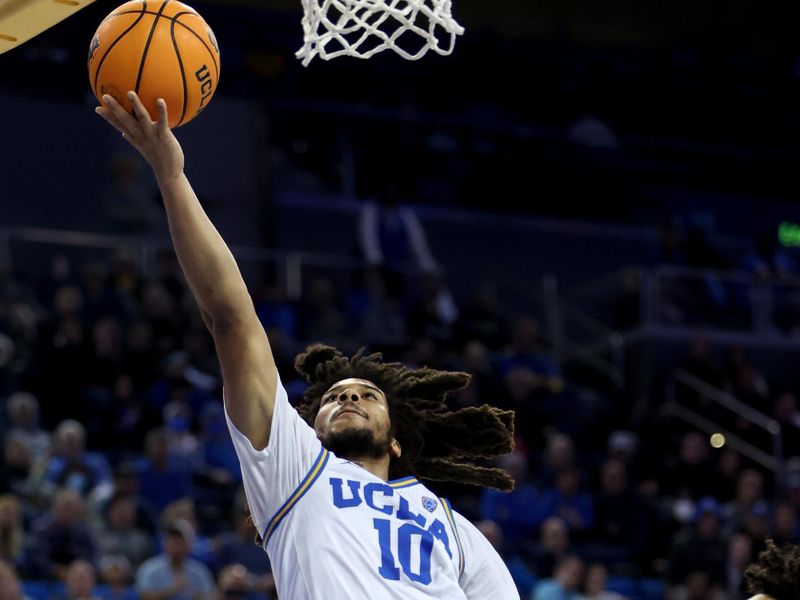 Jan 14, 2023; Los Angeles, California, USA;  UCLA Bruins guard Tyger Campbell (10) shoots the ball during the second half against the Colorado Buffaloes at Pauley Pavilion presented by Wescom. Mandatory Credit: Kiyoshi Mio-USA TODAY Sports